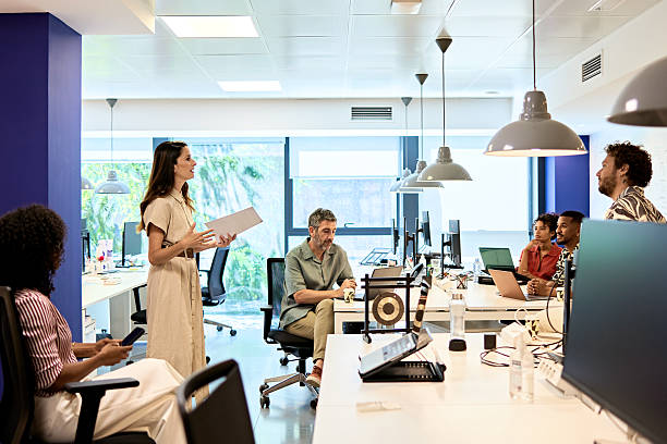 Office worker standing for a stretch break at their desk